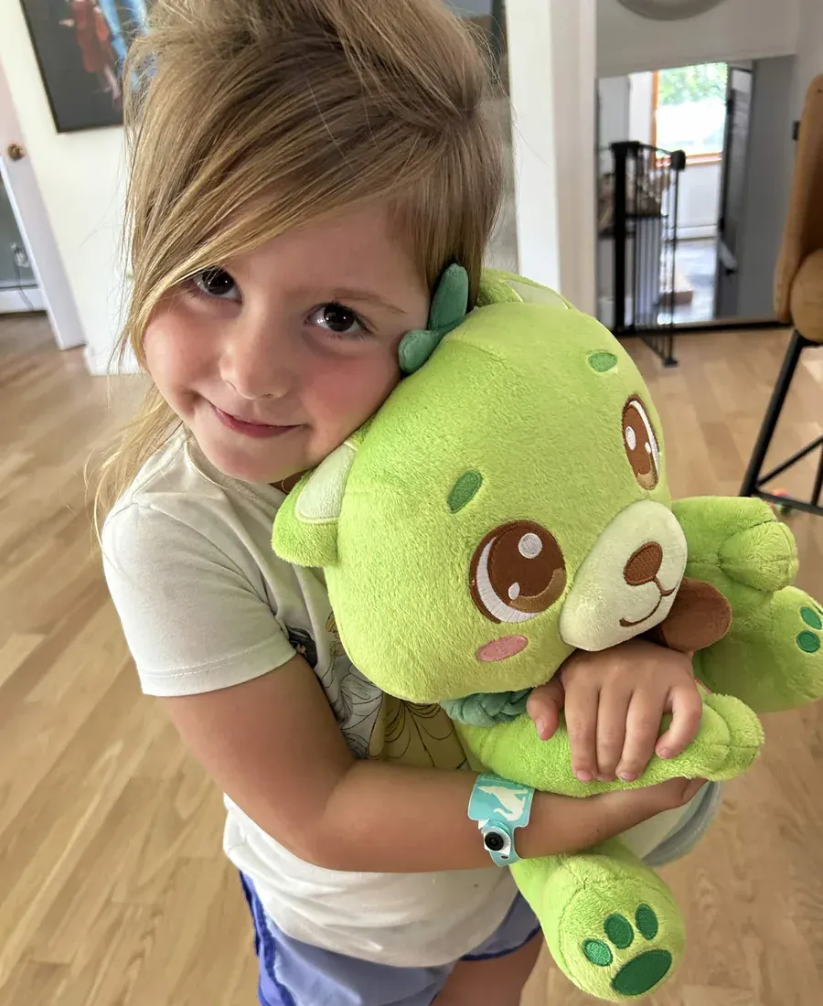 A girl hugging Sprout